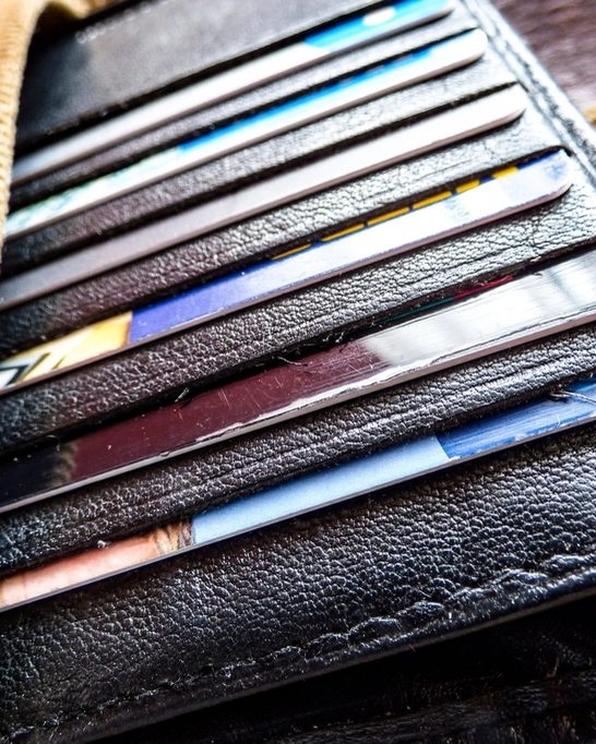 Close-up of payment cards tucked into a leather wallet